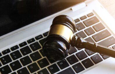 Selective focus image of judge gavel and keyboard. Cybercrime, legal, law and online auction concept